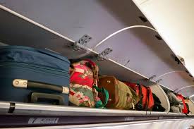 plane cabin bags in overhead carrier