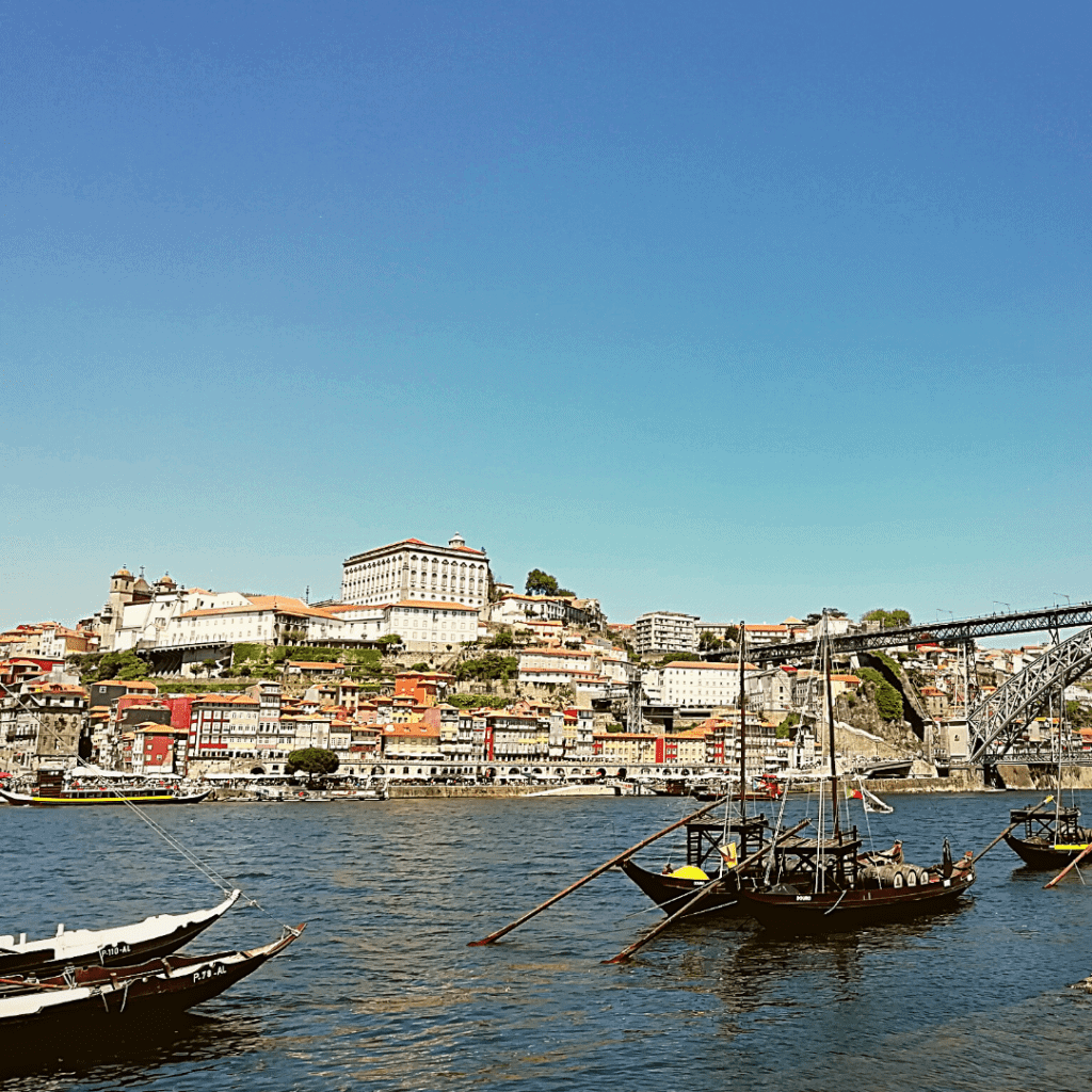 old boats on river Douro, view of the bridge in Porto, portugal