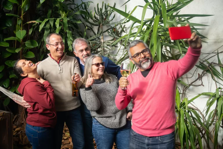 five elderly happy people taking selfie