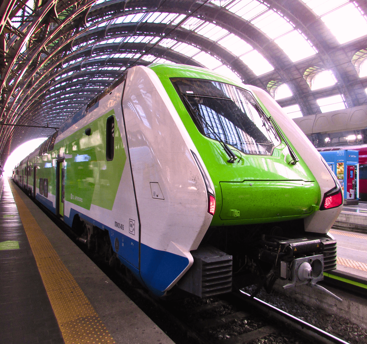 white green train in station